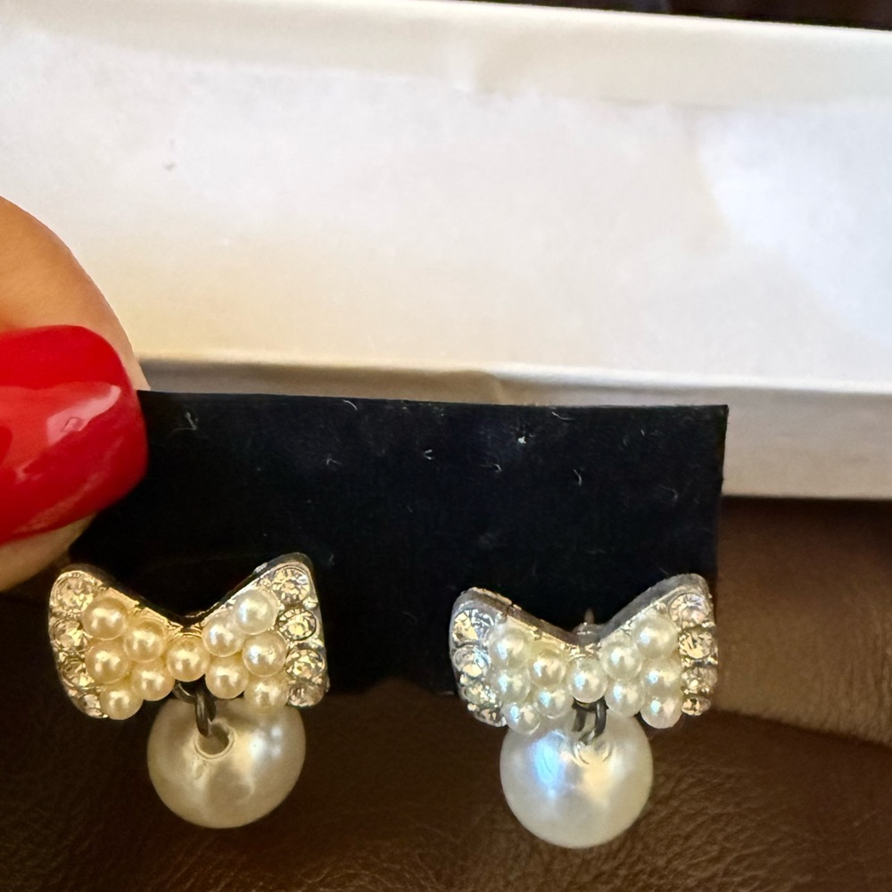 Faux white bow pearl earrings NIP and matching elastic bracelet set. Never worn. - Picture 2 of 4